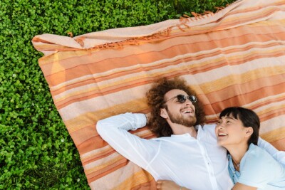 Image of a couple smiling in the park. This image could depict a couple thats been to sex therapy in atlanta, ga. get connected with a sex therapist in atlanta, ga today. 30024 | 30097