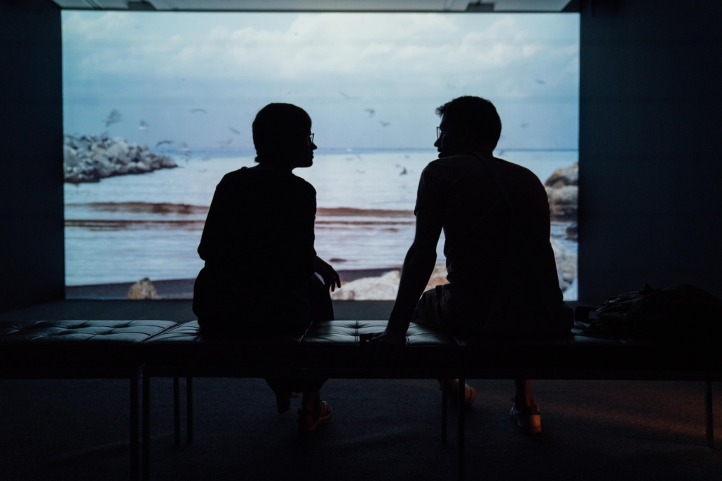 This is an image of a couple who is sitting at an aquarium. This image may depict a couple who is needing help resolving conflict. Get started with couples therapy in Atlanta, ga today. 30041 | 30043 | 30005