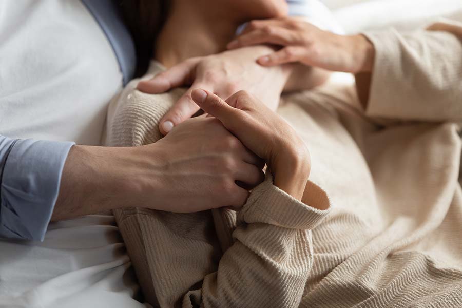 Image of couple in an embrace, holding one another. This image could depict a couple having completed sex therapy in Atlanta, GA. If you’re experiencing sexual performance anxiety, start meeting with a sex therapist in Atlanta, GA. 30518 | 30519