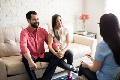 Photo of a couple speaking to a marriage counselor representing the work we do at our couples therapy practice. We help couples with affair recovery, porn addiction treatment and christian marriage counseling in Atlanta, GA