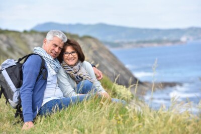 Photo of a couple near the ocean representing a couple who is traveling and has improved their relationship through marriage counseling. If you're looking to improve your marriage, the couples therapists at our Atlanta, GA area counseling practice can help!