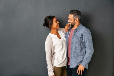 Image of couple smiling at one another. This image could depict a couple who has started sessions with a sex therapist in Atlanta, GA. Your relationship can benefit from sex therapy, too. | 30024 | 30097