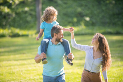 Couple looking happy with child. This image could depict a couple who has recently gone to affair recovery in atlanta, ga. get connected with a marriage counselor in atlanta, ga today! 30041 | 30043 | 30005